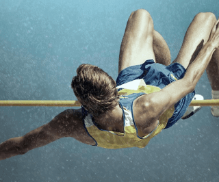 Atleta realizando um salto em altura 